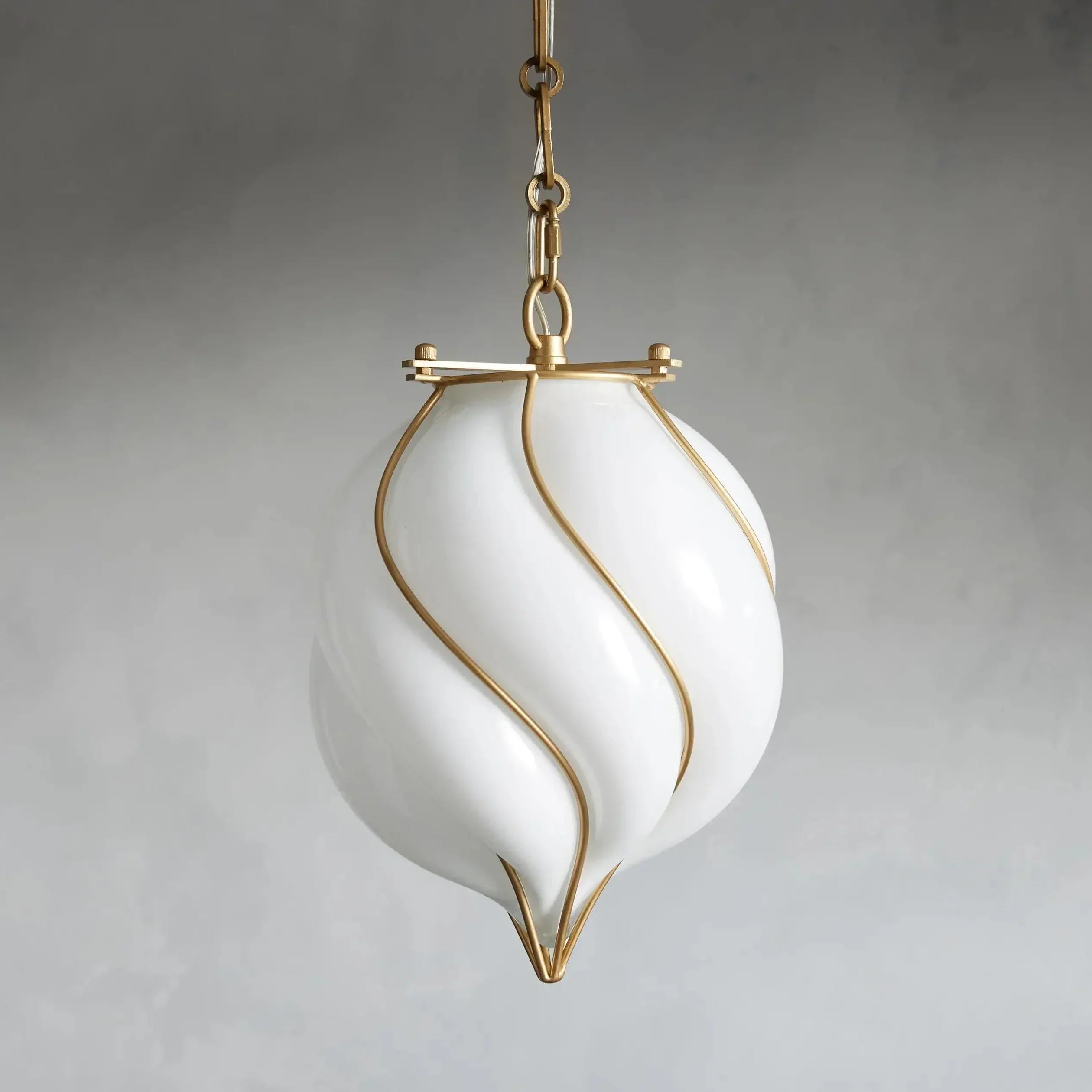 White pendant light with gold accents on a gray background