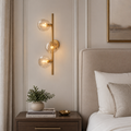Clear Glass Orb Cascade Wall Sconce